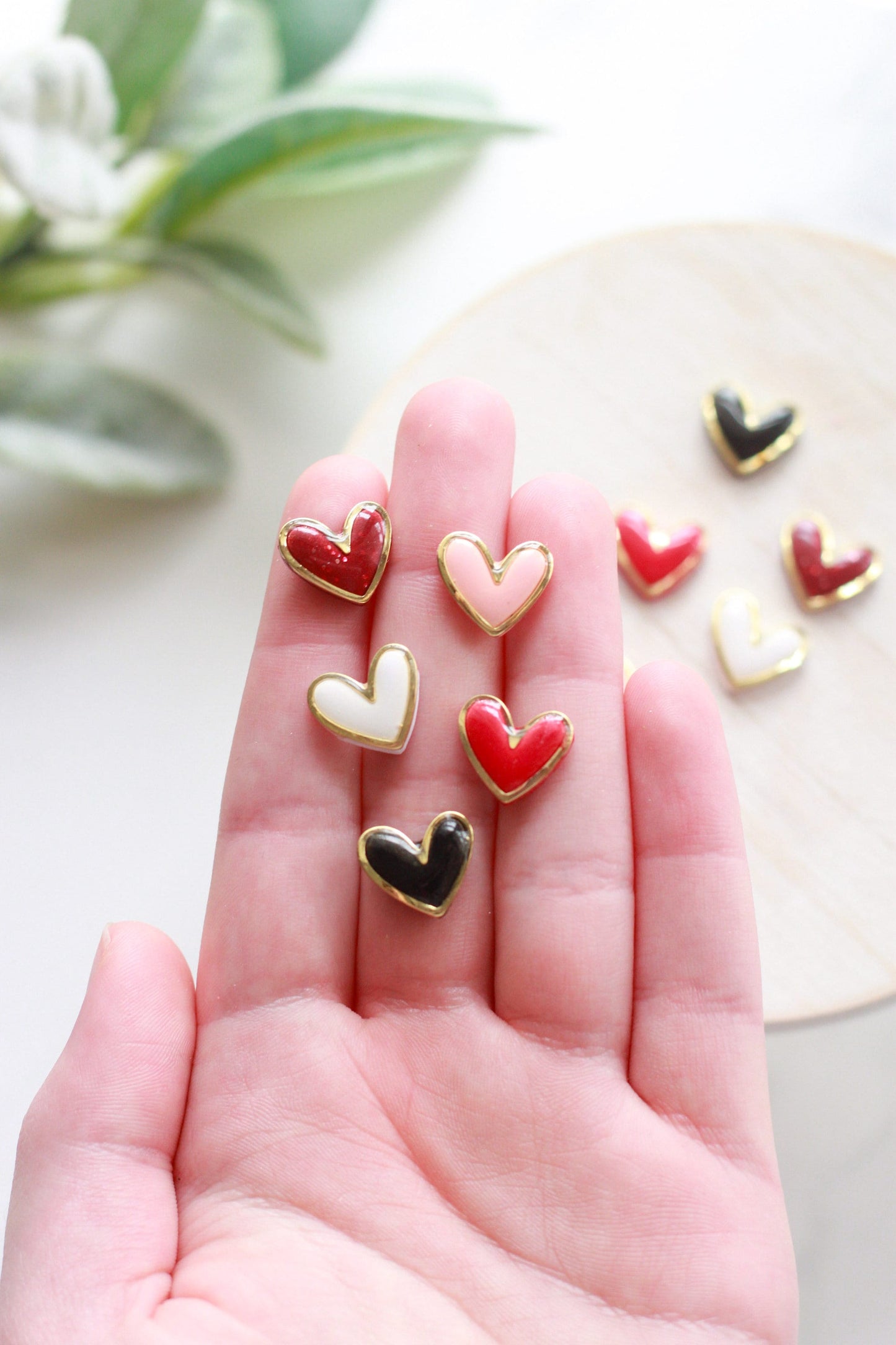 Gold Trimmed Heart Studs